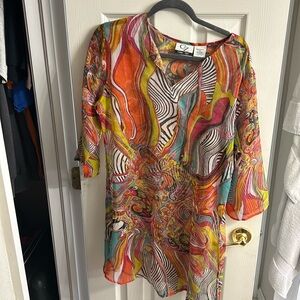 Sheer beach cover up. 100% polyester. Size: medium